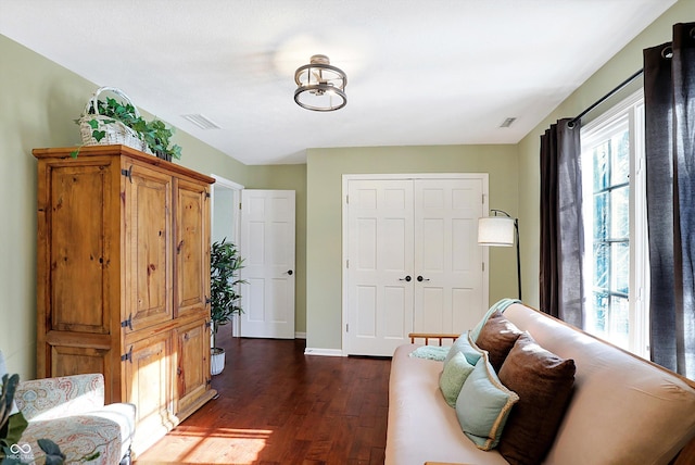 living area with dark hardwood / wood-style flooring