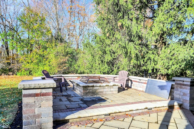 view of patio with a fire pit