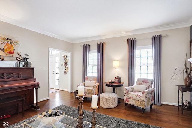 sitting room featuring crown molding and dark hardwood / wood-style floors