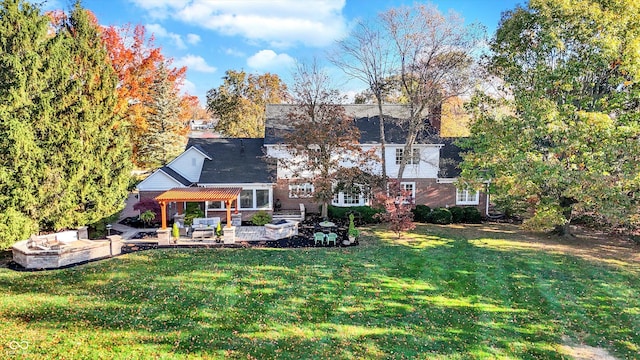 rear view of house with an outdoor hangout area, a patio, and a lawn