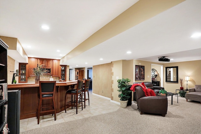 interior space featuring light colored carpet and backsplash