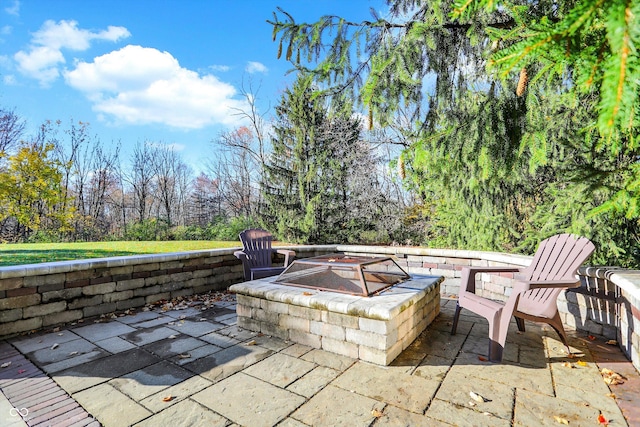 view of patio with a fire pit