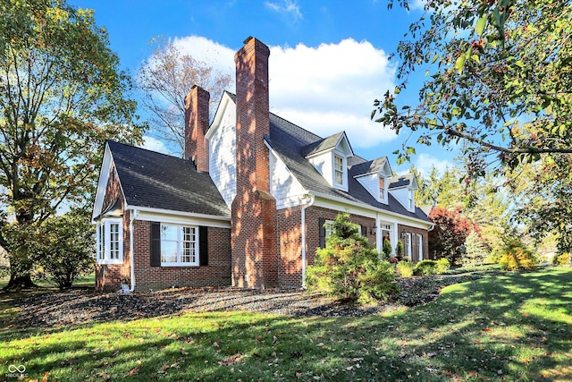 view of home's exterior featuring a yard