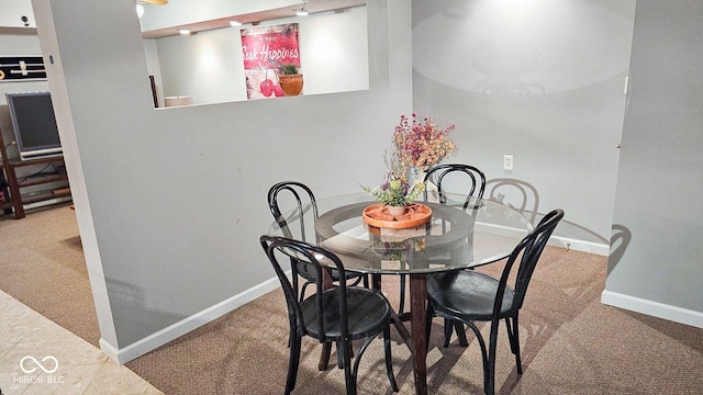 dining space with carpet