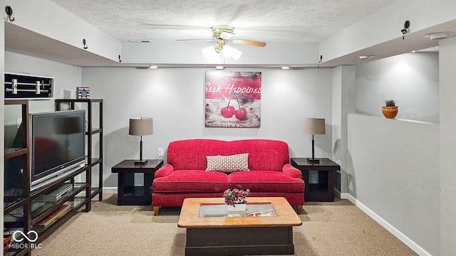 carpeted living room featuring a textured ceiling and ceiling fan