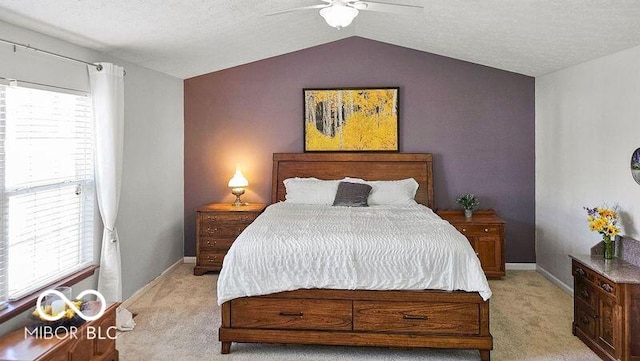 bedroom featuring ceiling fan, a textured ceiling, lofted ceiling, and light colored carpet