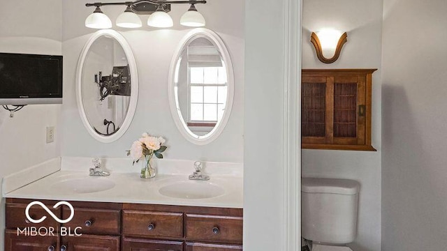 bathroom featuring vanity and toilet