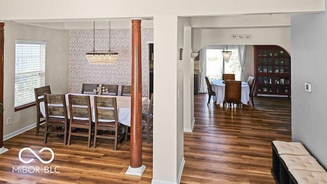 dining room featuring an inviting chandelier and dark hardwood / wood-style floors