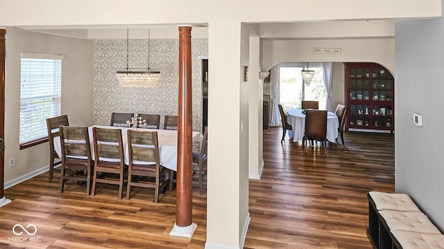 dining area featuring a chandelier and dark hardwood / wood-style floors