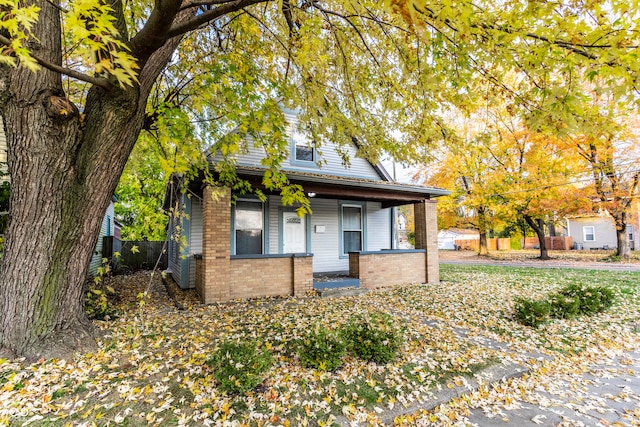 obstructed view of property with covered porch