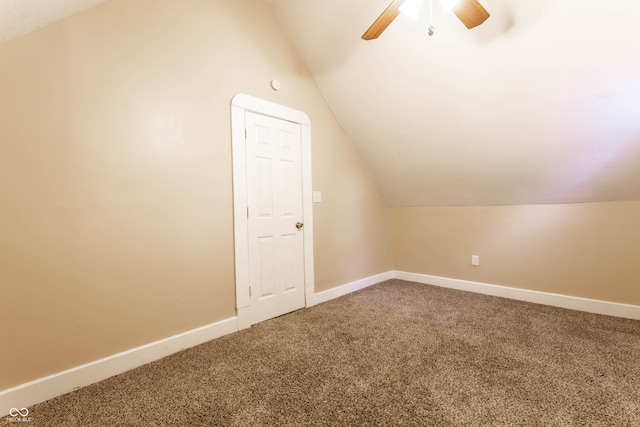 additional living space with ceiling fan, carpet, and lofted ceiling