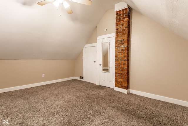 bonus room featuring ceiling fan, vaulted ceiling, and carpet floors