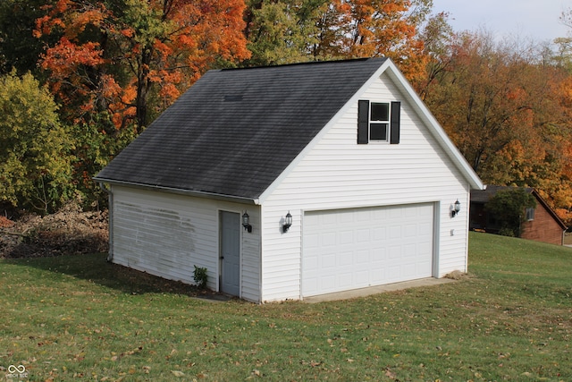 garage featuring a lawn