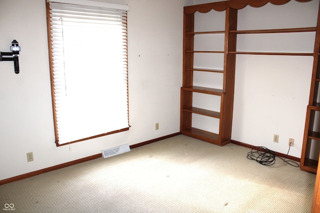 unfurnished bedroom featuring carpet