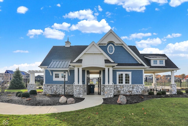 craftsman-style home with a front yard