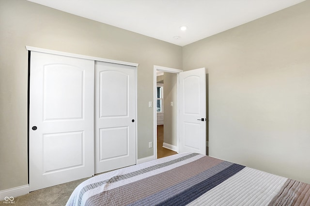 bedroom featuring a closet and carpet floors