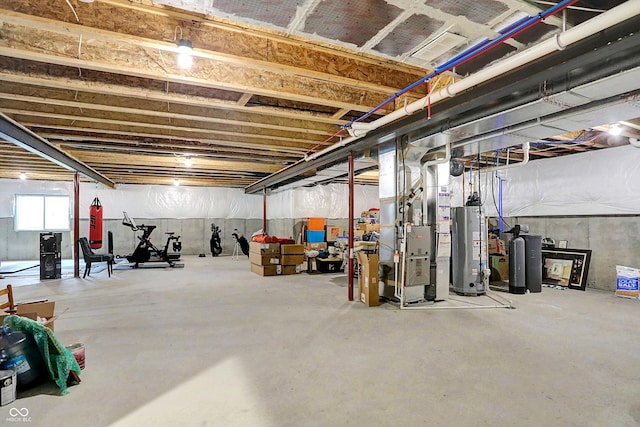 basement featuring gas water heater and heating unit