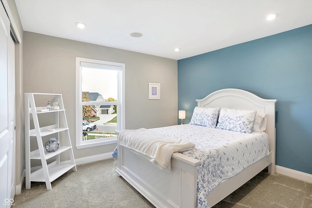 carpeted bedroom with a closet