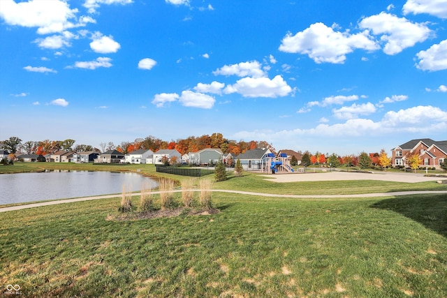 view of yard featuring a playground and a water view