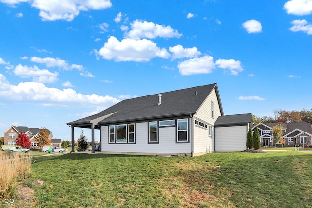 back of house with a yard