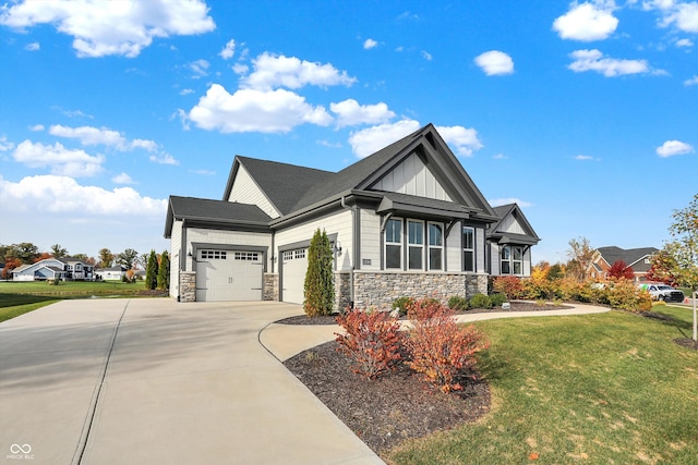 view of front of house featuring a garage and a front lawn