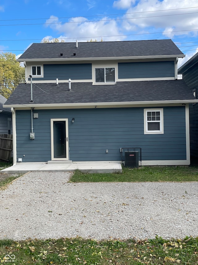 rear view of property featuring central AC and a patio