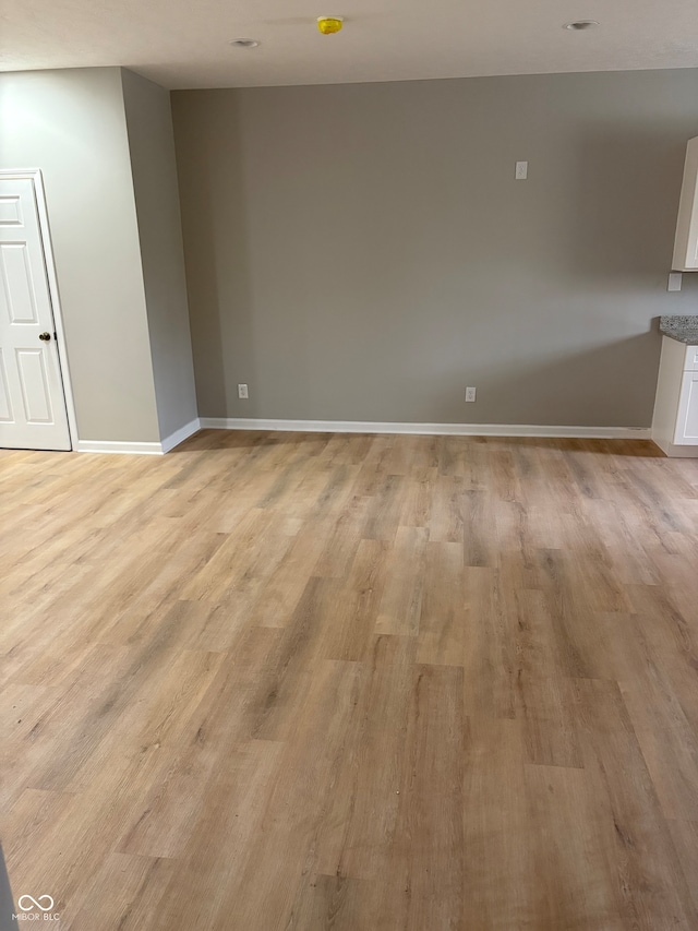 spare room featuring light hardwood / wood-style flooring