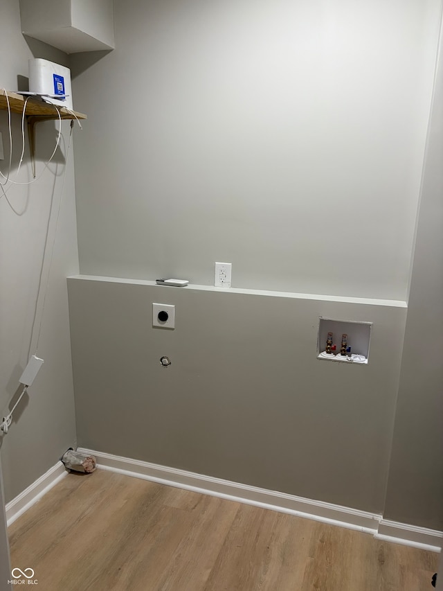 laundry room featuring hardwood / wood-style flooring, washer hookup, and electric dryer hookup