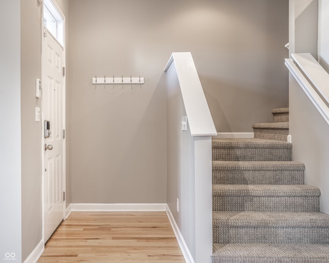 staircase featuring hardwood / wood-style floors