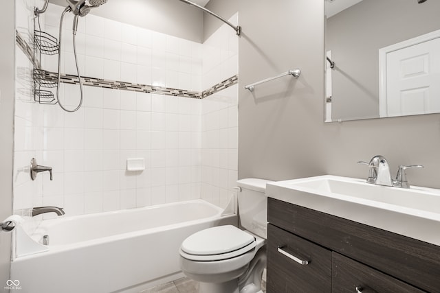 full bathroom with tiled shower / bath, vanity, toilet, and tile patterned flooring