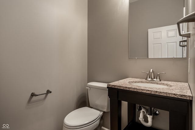 bathroom with toilet and vanity