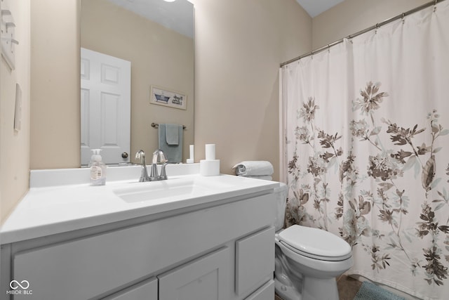 bathroom with vanity, toilet, and a shower with shower curtain