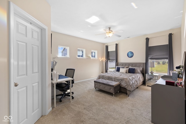 bedroom featuring light colored carpet and ceiling fan