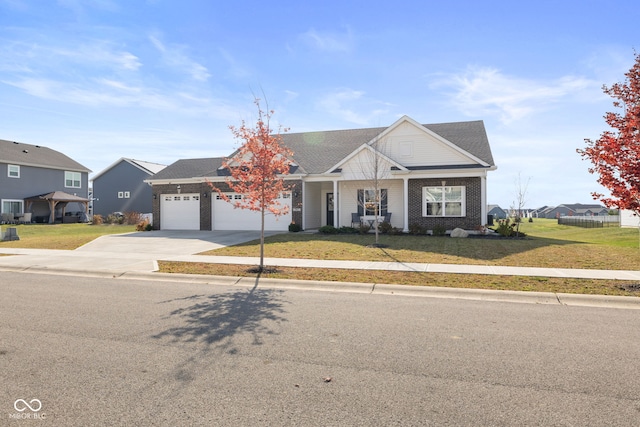 view of front facade with a front yard and a garage