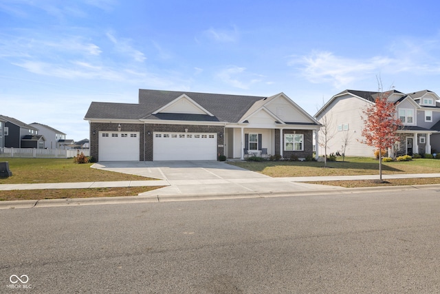 view of front facade featuring a garage and a front lawn