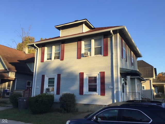 view of front of property with cooling unit