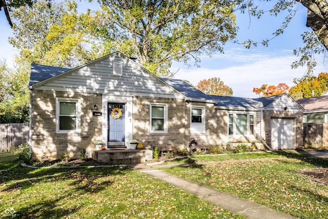 view of front of home featuring a garage and a front lawn