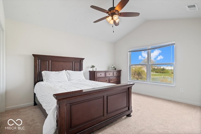 bedroom featuring vaulted ceiling, light carpet, and ceiling fan