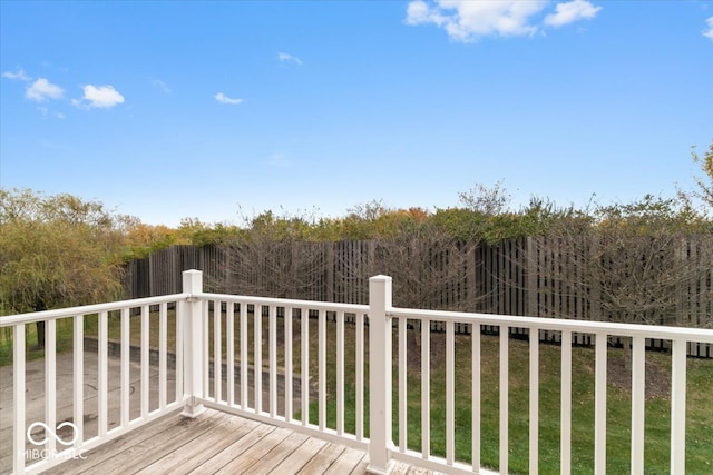 wooden terrace with a lawn