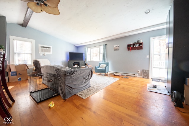 living room featuring a wall mounted air conditioner, a baseboard heating unit, lofted ceiling with beams, and hardwood / wood-style floors