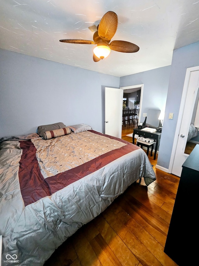 bedroom featuring ceiling fan and wood-type flooring