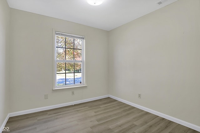 empty room with light hardwood / wood-style floors