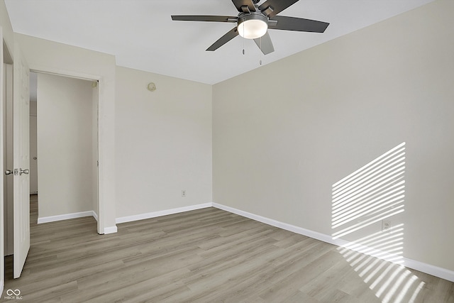 empty room with light wood-type flooring and ceiling fan