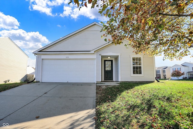 view of front of property with a garage and a front lawn