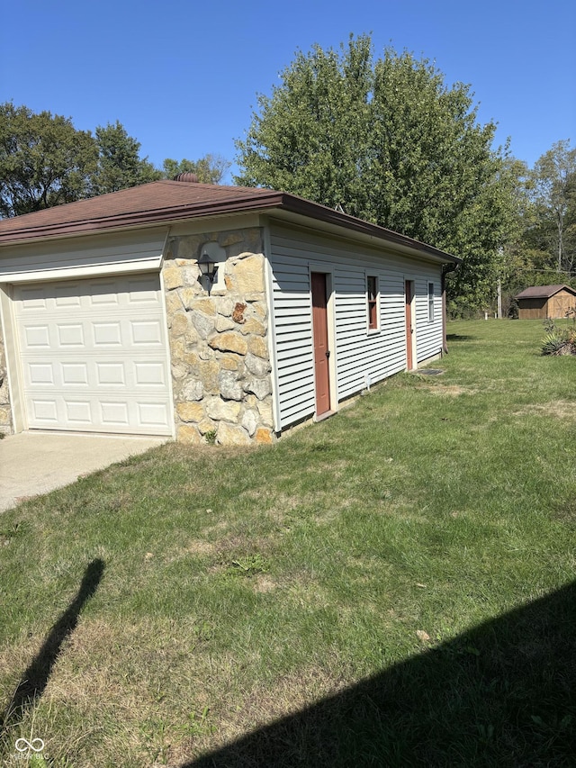 garage with a lawn