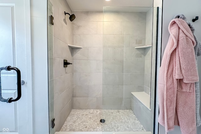 bathroom with a shower with shower door