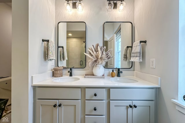 bathroom featuring vanity and a shower with shower door