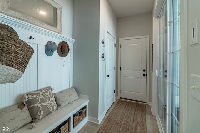 mudroom with light hardwood / wood-style flooring