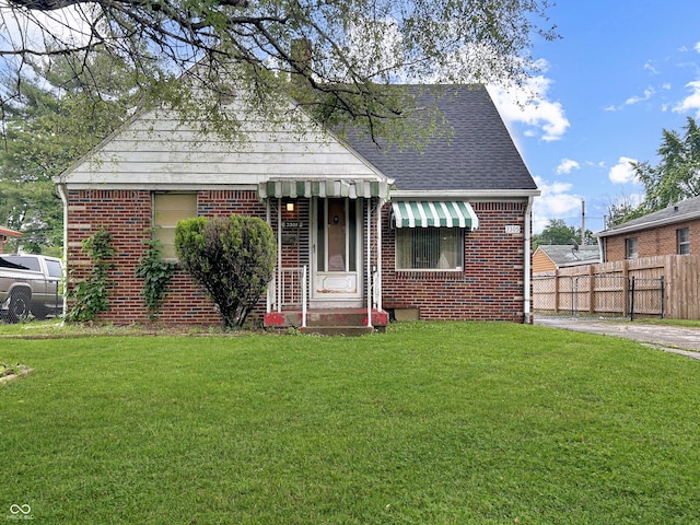 3305 N Keystone Ave, Indianapolis, IN 46218 - bungalow featuring brick siding and roof with shingles