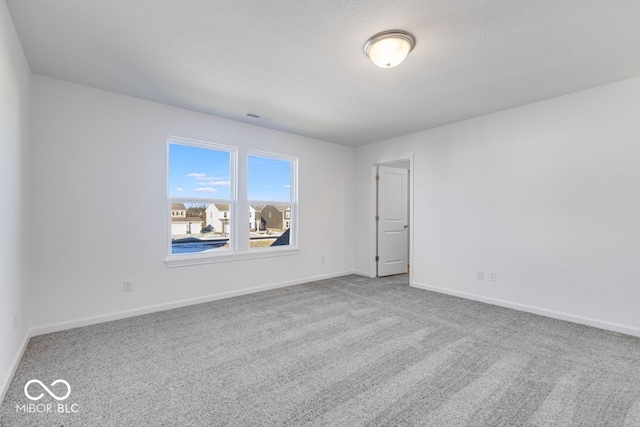 unfurnished room featuring carpet flooring